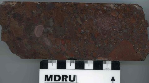 Upper volcanics of reddish andesitic volcanoclasitic to block and ash unit